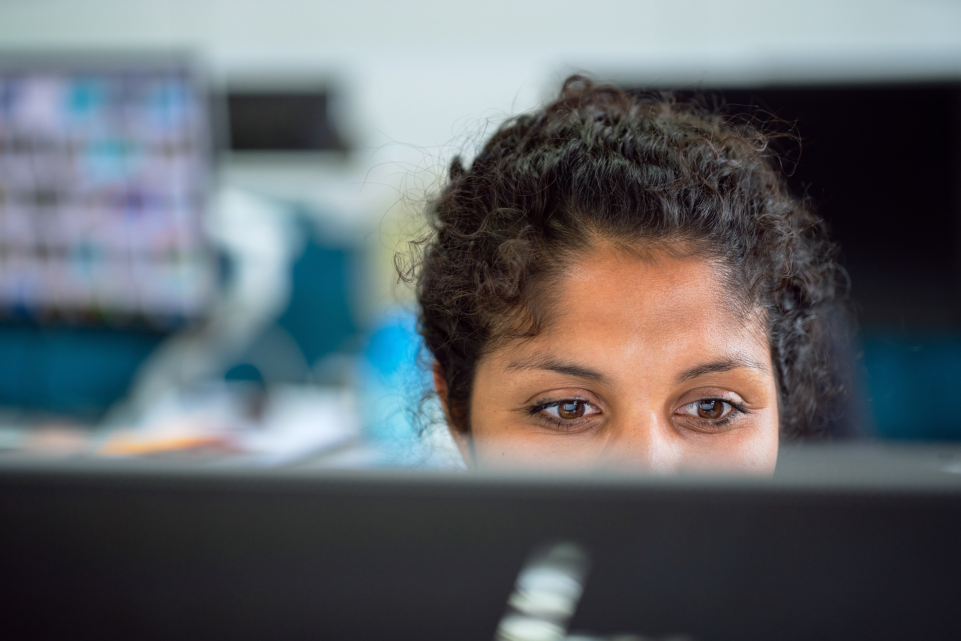 Woman behind computer screen authority